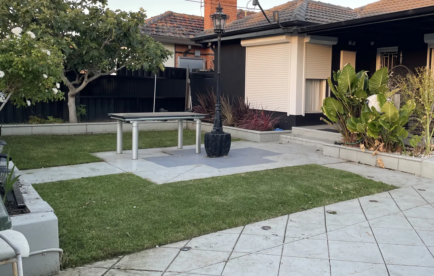 A front yard showcasing a newly cut lawn area